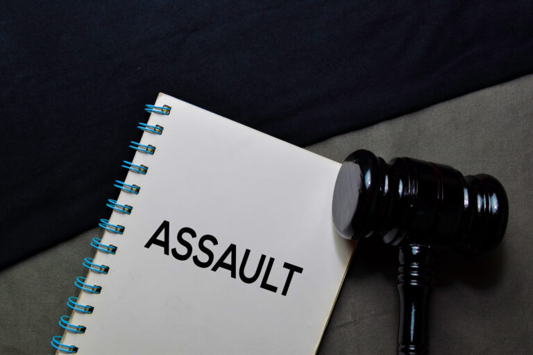 Assault,Text,On,A,Book,And,Gavel,Isolated,On,Office