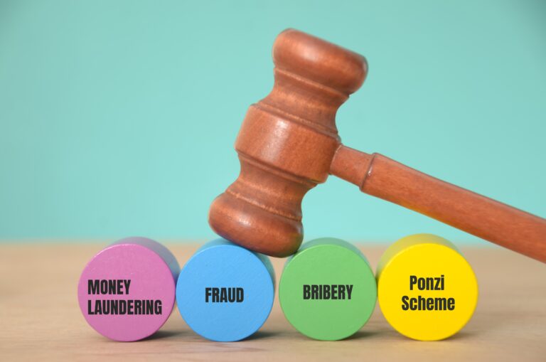 The,Gavel,,Positioned,Atop,The,Blocks,Labeled,”money,Laundering,”,”fraud,”