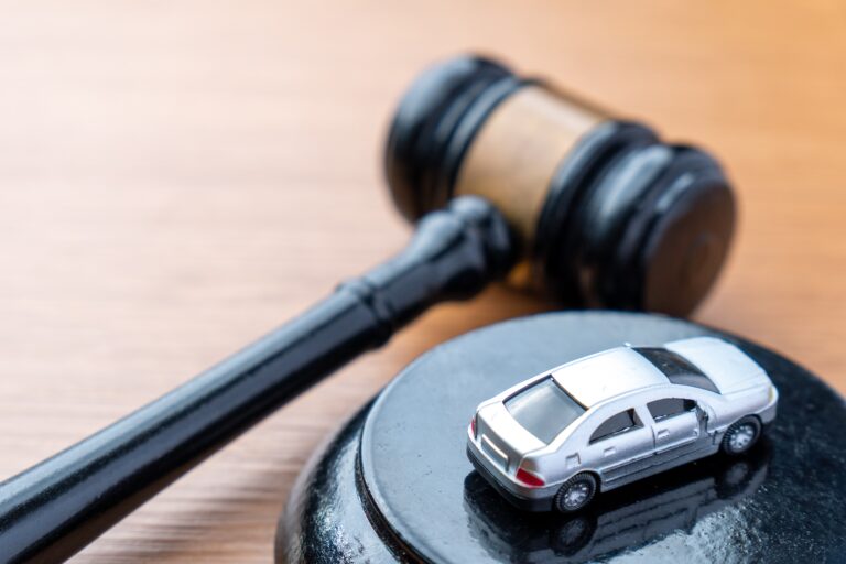 A,Judge,Gavel,And,A,Miniature,Car,On,A,Wooden