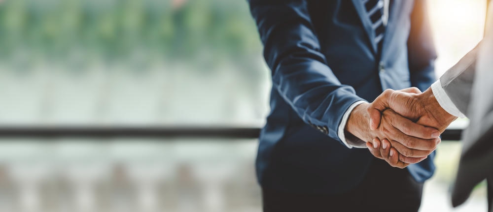 Business handshake | EAS Legal